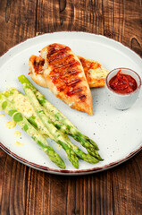 Grilled chicken breast with asparagus, healthy eating.