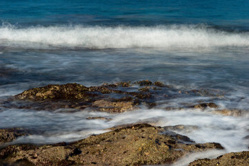 waves breaking on the rocks, Porto Ferro, Alghero, Sassari, Sardinia. Italy