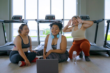 chubby women workout at fitness center.