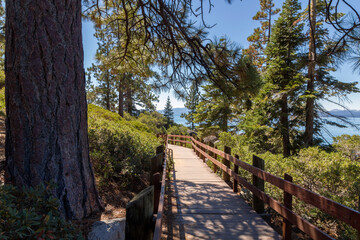 a beautiful hiking path directly at the coastline of the famous sand harbor beach of Lake Tahoe 