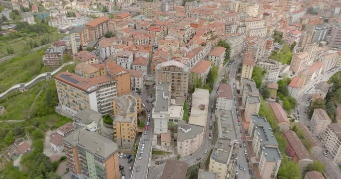 Aerial view of the historic center of the city of Potenza, in Basilicata, Italy. The houses in the old town have traditional red sloping roofs.