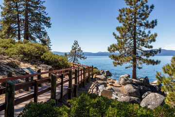 a beautiful hiking path directly at the coastline of the famous sand harbor beach of Lake Tahoe 