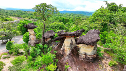 Sao Chaliang, part of Pha Taem National Park in Ubon Ratchathani, Thailand, reveals mesmerizing rock formations and ancient cave dwellings from a breathtaking drone perspective. Nature concept.
