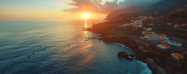 Aerial drone view of Ponta do Sol town during sunset, at the south coast of Madeira island,...