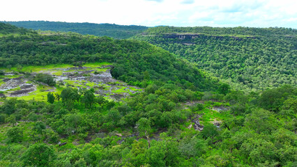 Pha Taem from a drone showcases geological strata, erosional features, and tectonic forces shaping Thailand's landscape. Pha Taem National Park, Ubon Ratchathani Province, Thailand.
