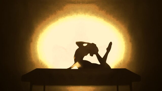 Agile woman performing acrobatics in studio 