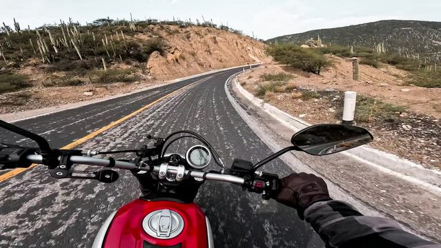 Motorcyclist driving on highway route.
