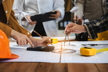 architect or engineer working on table use drawing tool on the paper plan for business architectural project.