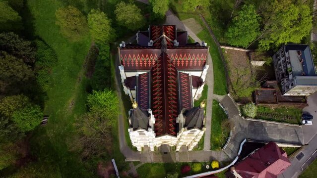Above View Of Neo-gothic Sacral Building Of Church of the Nativity of the Virgin Mary In Orlova, Silesia, Czech Republic. Aerial Shot