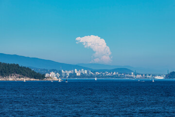 Vancouver cityscape with giant wildfires smoke cloud from the Kelowna wildfires in august 2023,...