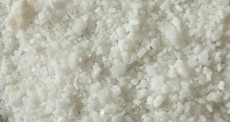 Organic sea salt as background, top view