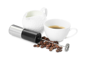 Mini mixer (milk frother), cup, coffee beans and pitcher isolated on white