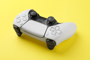 One wireless game controller on yellow background