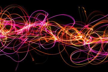 Electric neon lines intertwining in a chaotic display. A vibrant creation on black background.