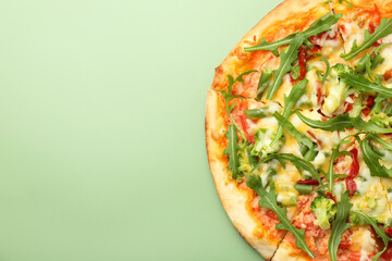 Delicious vegetarian pizza on green table, top view. Space for text