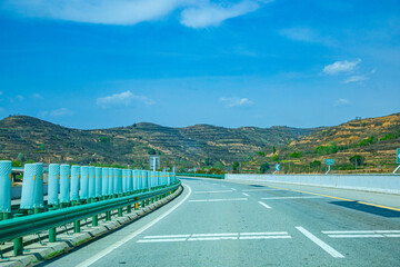 Pingliang City, Gansu Province - Road and field scenery under the blue sky