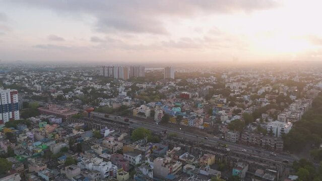 An immersive aerial footage revealing the vibrant life of Chennai, featuring residential neighborhoods, busy streets, and dynamic traffic patterns.