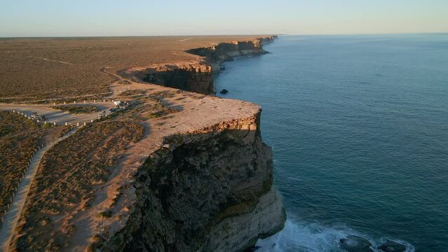 Wide angle view of Nullarbor Cliffs during afternoon with parking area in South Australia. Drone shot.