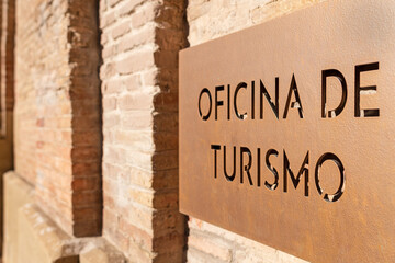 Tourist office sign in monumental city. 

