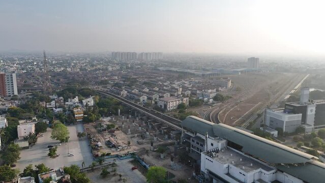 A cinematic drone shot of Chennai, capturing the city's energetic vibe and architectural beauty.