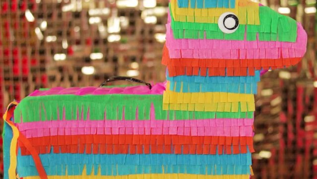 Colorful paper burrito pinata, close up isolated party decor