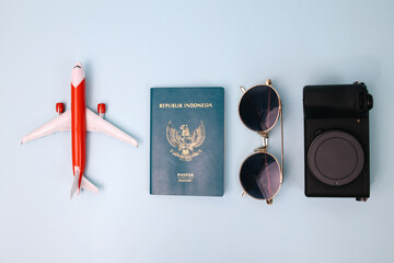 Airplane, Passport, Sunglasses and Camera for Travel and Holidays Background