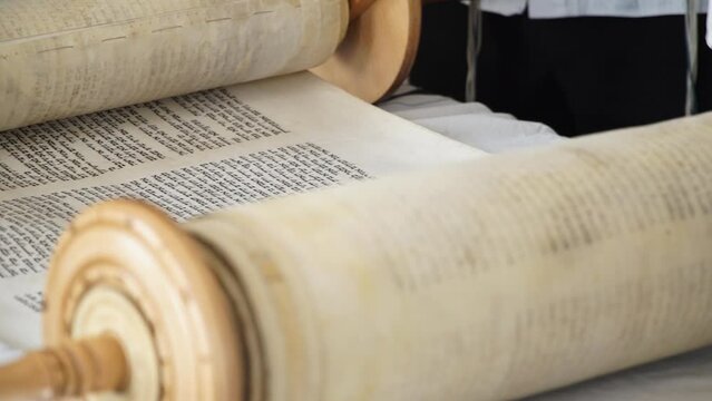 Hand of young boy reading the Jewish Torah at Bar Mitzvah Bar Mitzvah Torah