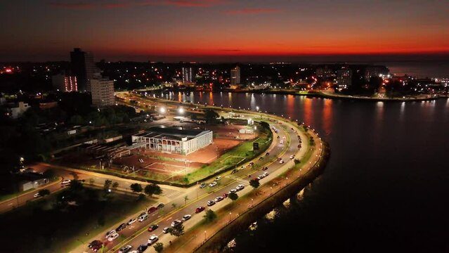 Aerial forward shot of Posadas city scape at night, Argentina.

