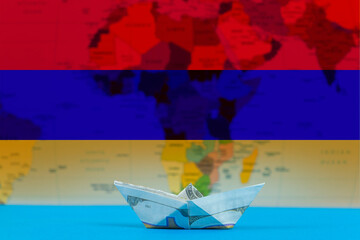 Sea transport of Armenia concept, paper ship with Armenia flag, international transportation trade 