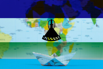 Sea transport of Lesotho concept, cargo and logistics idea, paper ship with Lesotho flag
