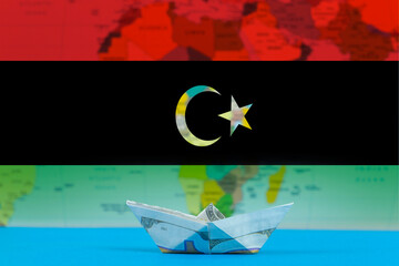 Sea transport of Libya concept, bulk carrier or ships on sea, paper ship with Libya flag