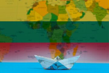 Sea transport of Lithuania concept, bulk carrier or ships on sea, paper ship with Lithuania flag