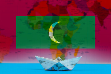 Sea transport of Maldives concept, international transportation trade or imports, paper ship with 