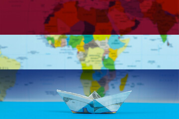 Sea transport of Netherlands concept, paper ship with Netherlands flag, international 