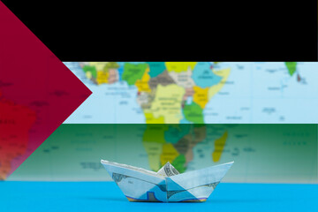 Sea transport of Palestine concept, paper ship with Palestine flag, cargo and logistics idea
