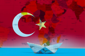 Sea transport of Turkey concept, cargo and logistics idea, paper ship with Turkey flag
