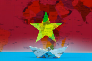 Sea transport of Vietnam concept, paper ship with Vietnam flag, international transportation trade 