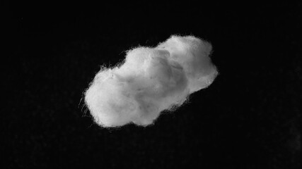a white cotton cloud on a black background