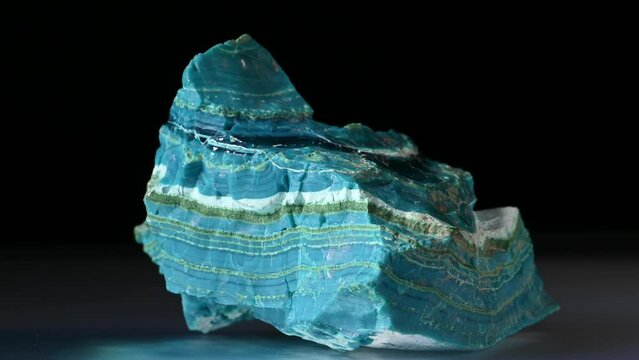 Chrysocolla [copper silicate hydroxide] banded with layers of malachite and gem silica, rotating slowly