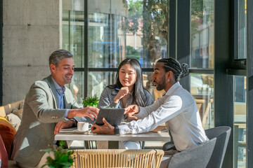 interracial business corporative workers having a meeting during a break
