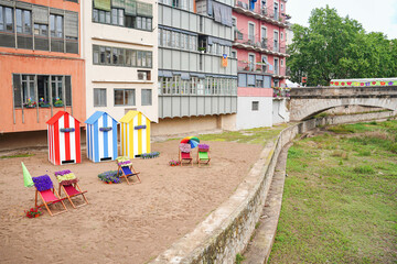 A beach scene with three colorful beach houses in the city. Summertime in the urban scene