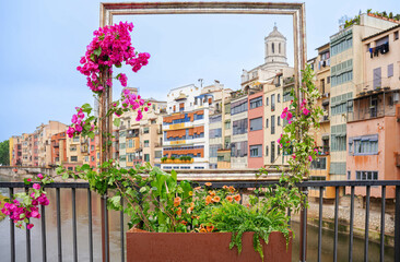 frame of Girona city and the river. Travel destination in flower festival