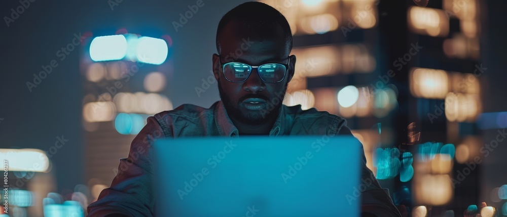 Poster the image depicts a handsome black project manager making a video call on a laptop computer in an ev
