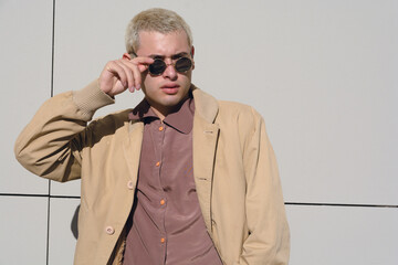 cool attitude man at sunset on street with sunglasses