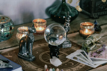 Esoteric Tarot and Crystal Ball Setup with Mystical Decor.