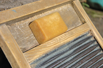 laundry soap on an old washing board for hand washing. selective focus