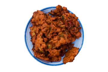 Isolated side view of Basin Pakora, Side shot of Popular indian or pakistani street food snack on white background, Diwali dinner or iftar meal, Pakoda dish for christmas party.