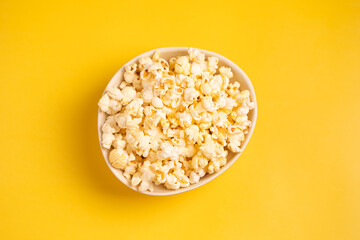 Popcorn on a yellow background.Top view