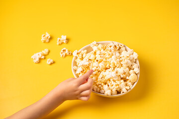 Popcorn on a yellow background.Top view