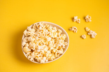 Popcorn on a yellow background.Top view